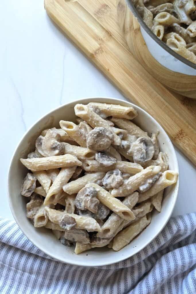 Easy vegan mushroom stroganoff done in 20 minutes, oil free, and high in protein. For 660 calories you get over 30 g plant based protein!