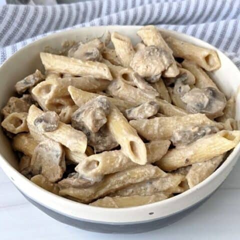 Easy vegan mushroom stroganoff done in 20 minutes, oil free, and high in protein. For 660 calories you get over 30 g plant based protein!