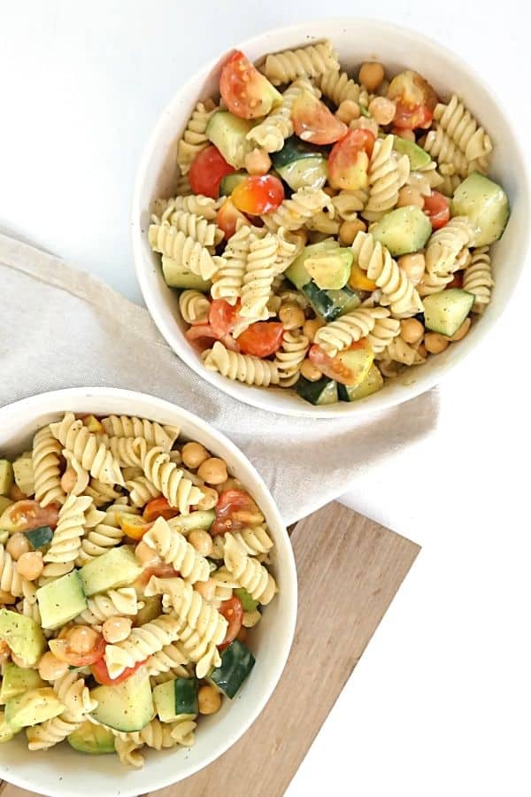 two bowls of plant based pasta salad with oil free dressing