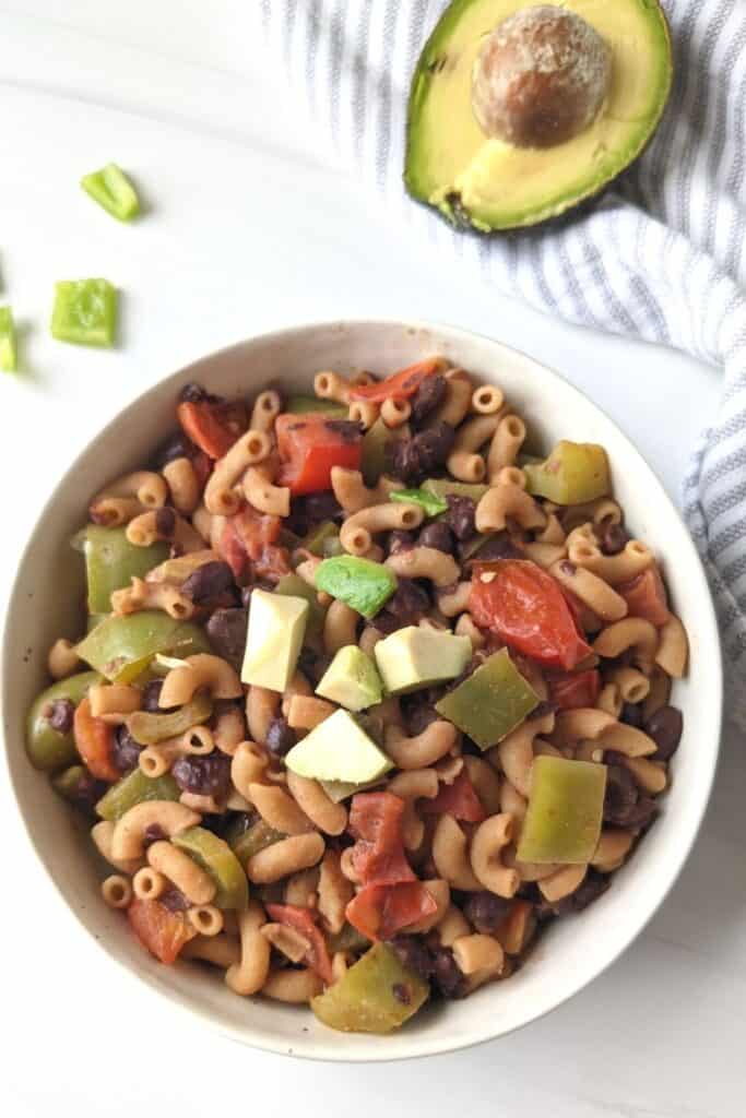 easy taco pasta with elbow pasta in a bowl. Whole food plant based taco pasta recipe
