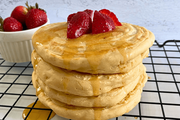 Easy vegan protein pancake recipe. Super fluffy high protein vegan treat with no egg, no dairy, no sugar, and low fat. 